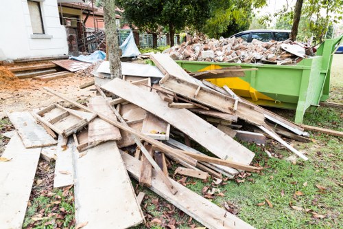 Cluttered garage before clearance in West London